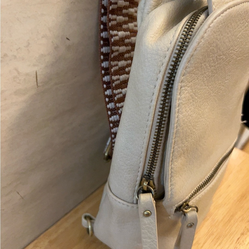 Urban Expressions Liberty leather sling bag with a chevron pattern strap. - Picture 3 of 16